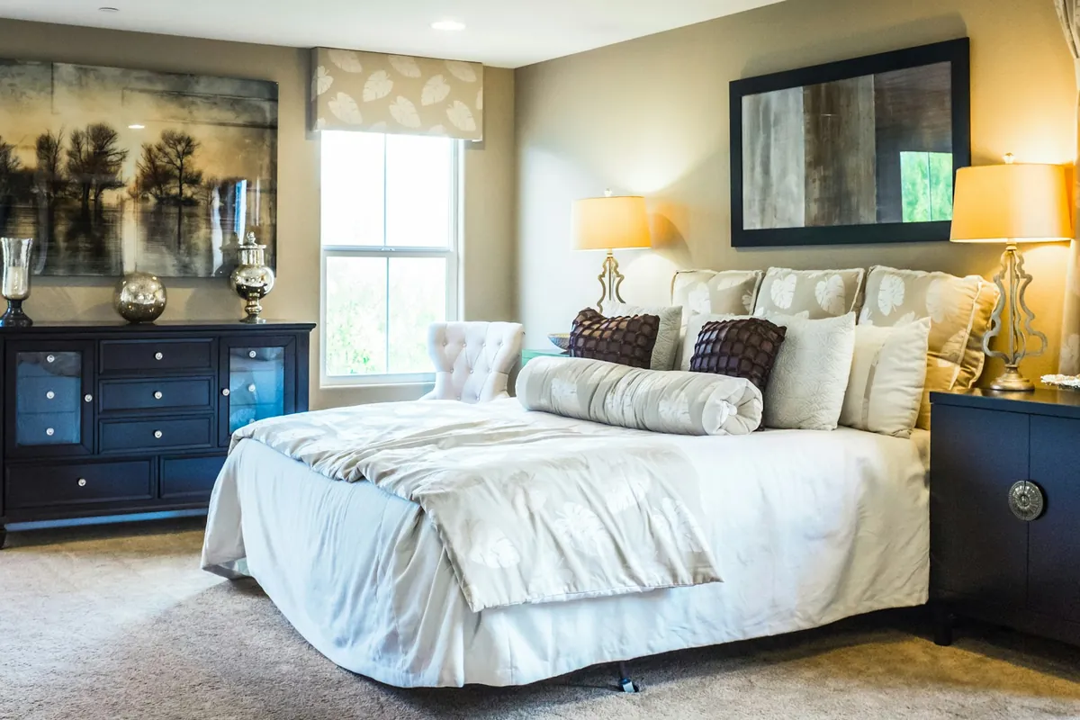 Upper-level bedroom retreat with rich fabrics and tonal contrast