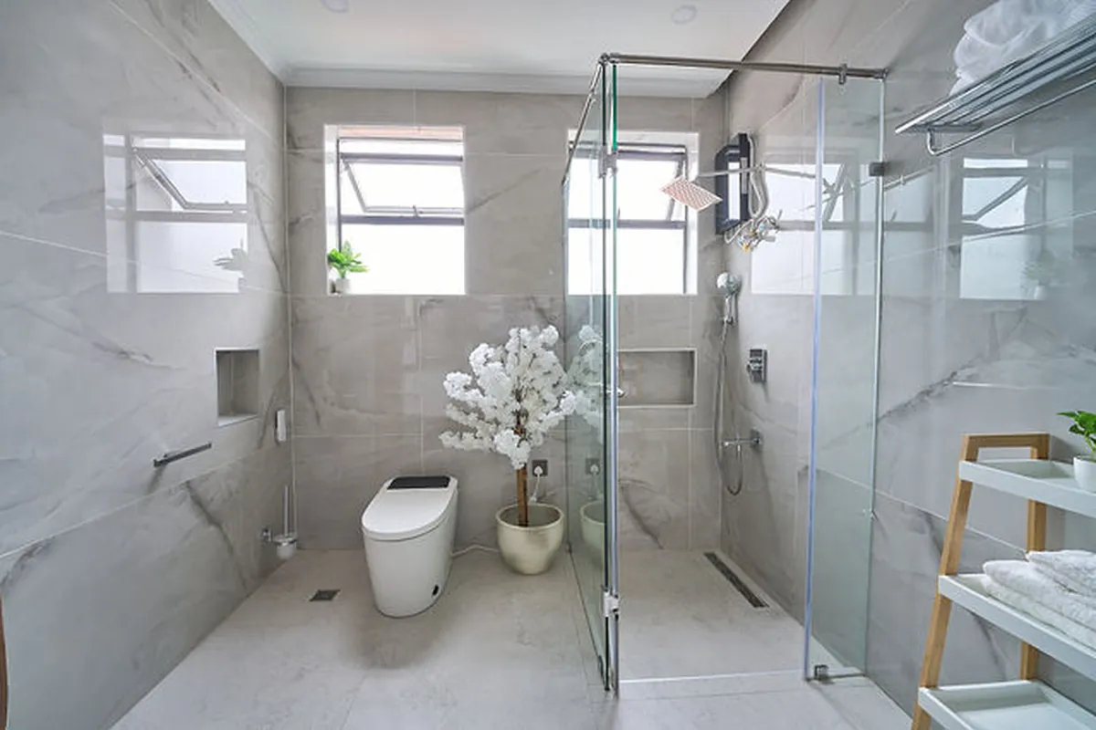 Powder room detail with terrazzo flooring and sculptural sink installation