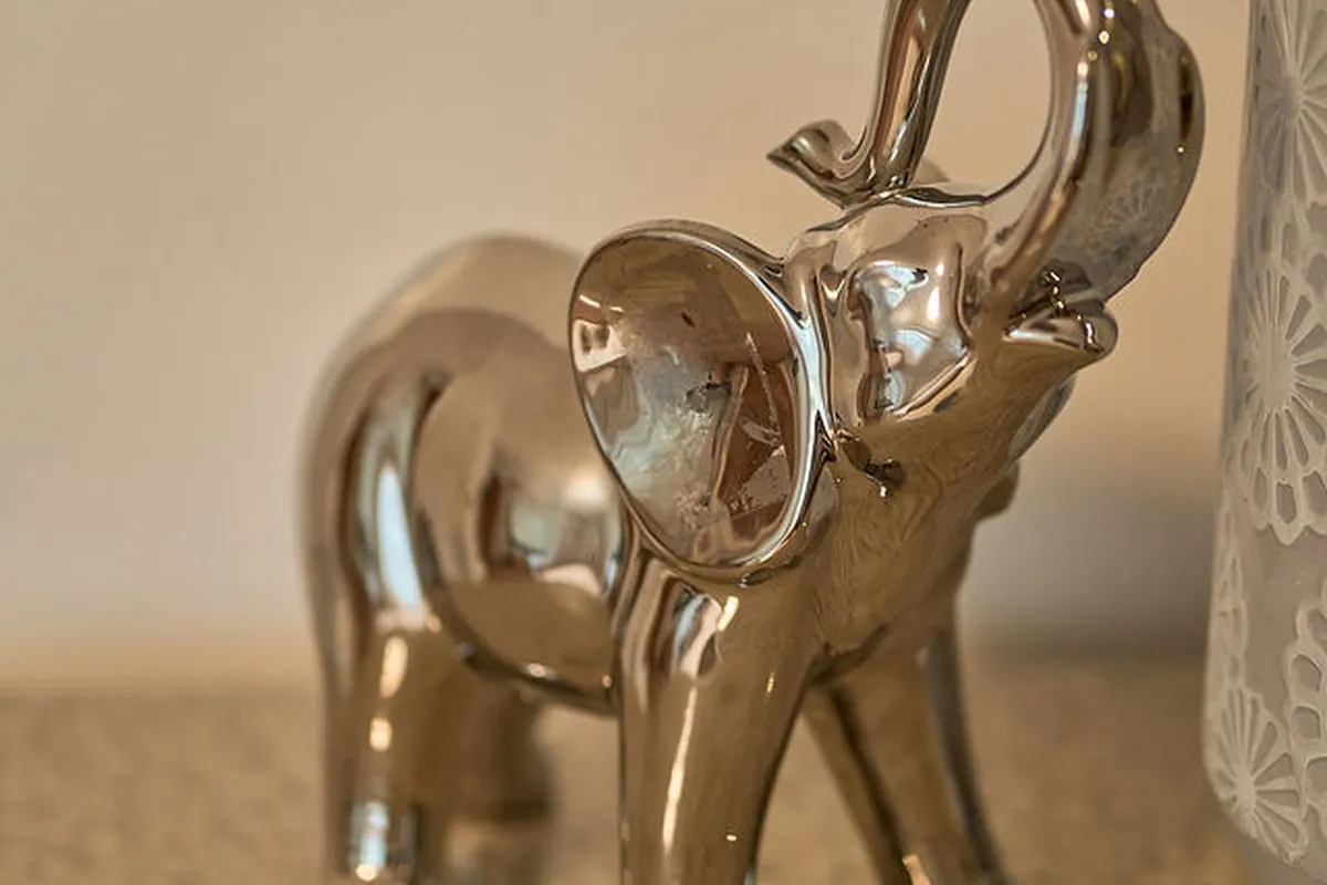 Guest suite with layered lighting and neutral palette creating intimate comfort