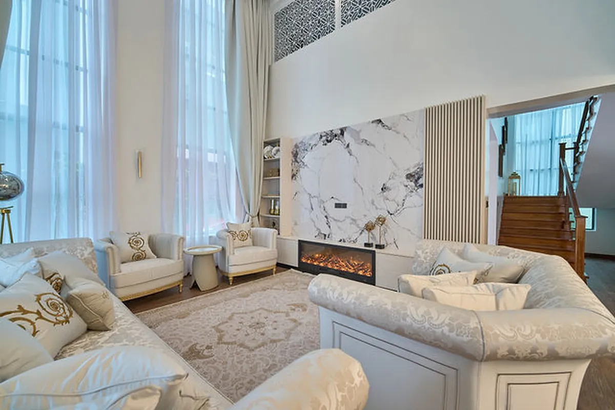 Dining corner anchored by stone textures and statement pendant lighting