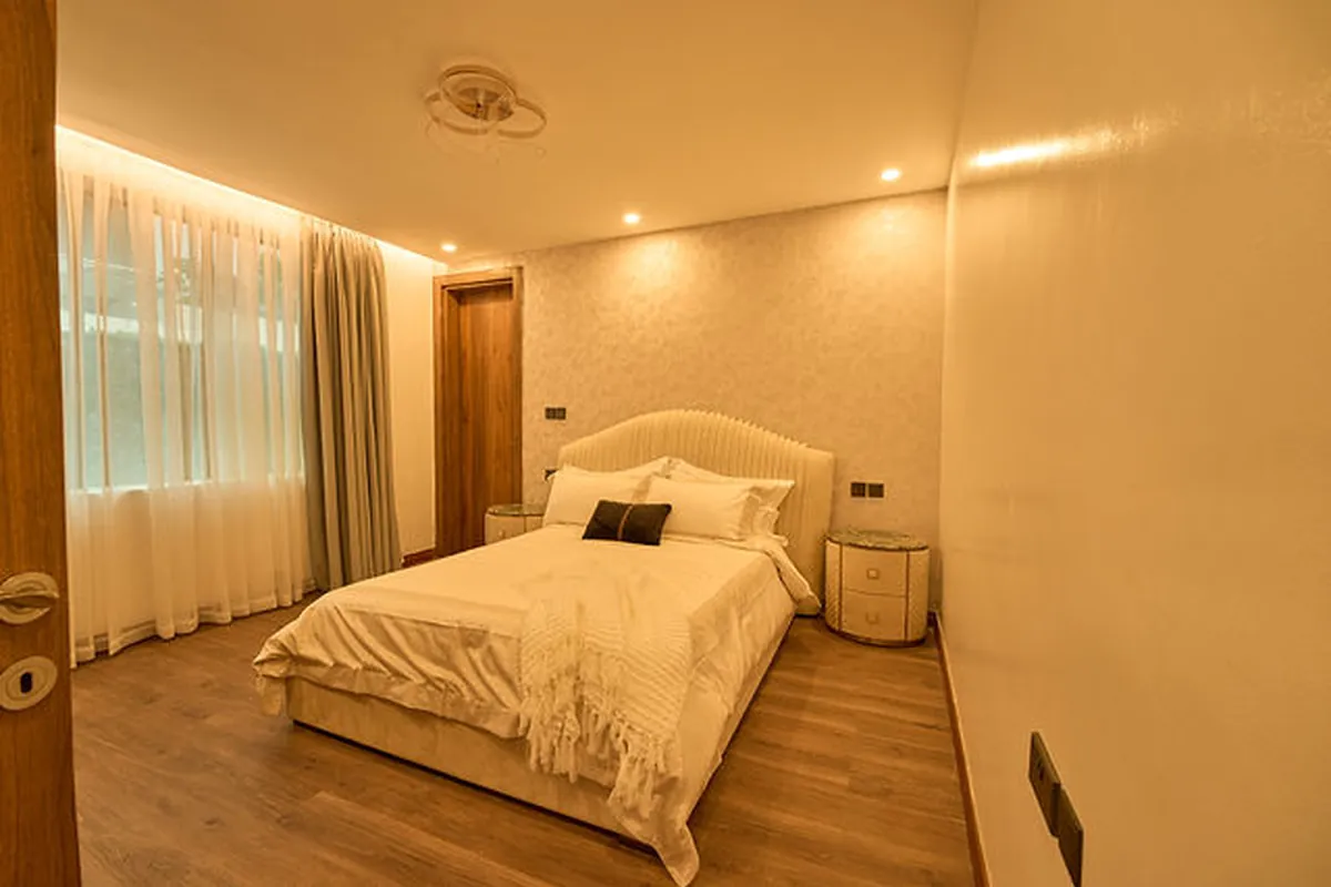 Custom millwork detail integrating concealed storage and display niches