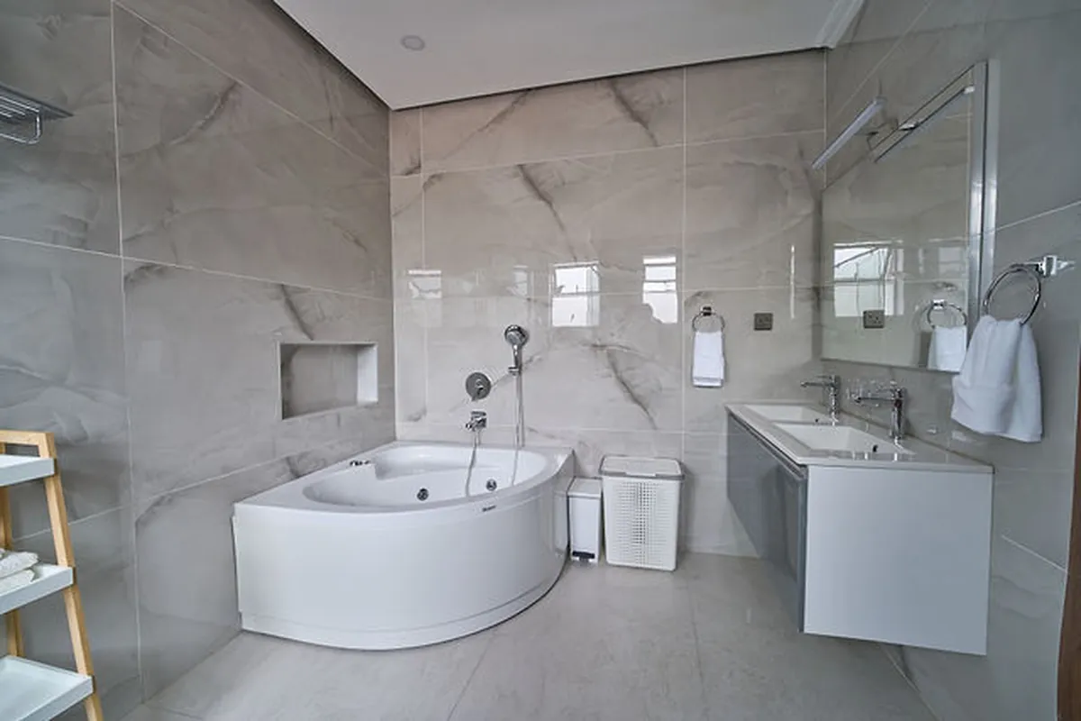 Kitchen interface showcasing integrated appliances and brass hardware accents